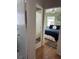Inviting bedroom with wood floors, light green walls, and access to a bathroom at 1339 Orchid Ave, Winter Park, FL 32789