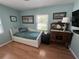 Light-filled bedroom with daybed, wood floors and an antique dresser adding warmth and charm at 1339 Orchid Ave, Winter Park, FL 32789