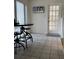 Tile-floored dining area featuring a small table with stools and a glass paneled door at 1339 Orchid Ave, Winter Park, FL 32789