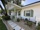 Charming home featuring a cozy front porch, manicured landscaping, and a welcoming entrance at 1339 Orchid Ave, Winter Park, FL 32789