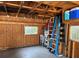 Spacious garage with exposed wooden beams and rafters provides ample storage at 1339 Orchid Ave, Winter Park, FL 32789