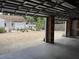 View from inside garage showing the gravel backyard and fenced in yard at 1339 Orchid Ave, Winter Park, FL 32789