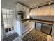 Bright kitchen featuring white cabinets and appliances plus decorative glass block at 1339 Orchid Ave, Winter Park, FL 32789