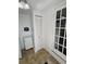 Laundry room with washer and dryer, a storage cabinet and access to the back door at 1339 Orchid Ave, Winter Park, FL 32789