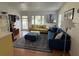 Cozy living room with a large window, comfortable seating, and a beautiful rug at 1339 Orchid Ave, Winter Park, FL 32789