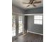 Living space features a ceiling fan, wood floors, a window and glass double doors that offer exterior views at 1339 Orchid Ave, Winter Park, FL 32789