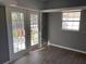 Bright living space with wood floors, a window and glass double doors that let in abundant natural light at 1339 Orchid Ave, Winter Park, FL 32789