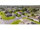 Aerial view of a residential neighborhood with well-maintained lawns and mature trees at 13643 Se 89Th Ct, Summerfield, FL 34491