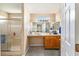 Bright bathroom features a walk-in shower and a vanity with ample counter space at 13643 Se 89Th Ct, Summerfield, FL 34491