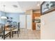 Dining room with tile floors, kitchen access, and bright natural light at 13643 Se 89Th Ct, Summerfield, FL 34491