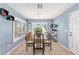 Light-filled dining room featuring tile floors and a view to the backyard at 13643 Se 89Th Ct, Summerfield, FL 34491