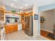 Kitchen with stainless steel appliances, a breakfast bar, and wood cabinets at 13643 Se 89Th Ct, Summerfield, FL 34491