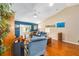 Cozy living room with plush seating, hardwood floors, and natural light at 13643 Se 89Th Ct, Summerfield, FL 34491