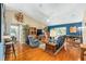 Spacious living room with hardwood floors and an open floor plan at 13643 Se 89Th Ct, Summerfield, FL 34491