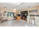 Open office leading into living area boasts neutral walls, tiled floors and modern track lighting at 13643 Se 89Th Ct, Summerfield, FL 34491