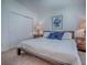 Comfortable bedroom with two bedside tables, plush bedding, and a large closet with sliding doors at 1406 Zest Ave, The Villages, FL 32163