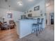 Kitchen with breakfast bar and extra seating, offering an inviting space for dining and socializing at 1406 Zest Ave, The Villages, FL 32163