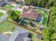 Aerial view of a fenced property with a pool, shed, gazebo, and young home orchard at 15664 Se 97Th Ave, Summerfield, FL 34491
