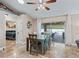 Cozy dining area with tile floors, leading to the backyard, complemented by a bedroom entrance at 15664 Se 97Th Ave, Summerfield, FL 34491
