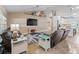 Bright living area boasting tile floors, high ceilings, and an entertainment setup at 15664 Se 97Th Ave, Summerfield, FL 34491