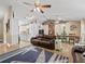 Open-concept living space with tile floors, leather sofas, dining area, and kitchen access at 15664 Se 97Th Ave, Summerfield, FL 34491