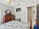The bedroom has a TV, stylish furnishings and decor, and access to the bathroom at 17380 Se 111Th Ct, Summerfield, FL 34491