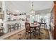 Charming dining area adjacent to the kitchen with seating for four and decorative chandelier at 17380 Se 111Th Ct, Summerfield, FL 34491