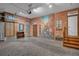 Spacious basement featuring an alley painted on a brick wall and three doors at 1956 Brantley Cir, Clermont, FL 34711