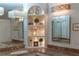 Bathroom with marble countertops, decorative mirrors, and a decorative built-in niche at 1956 Brantley Cir, Clermont, FL 34711
