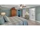 Cozy bedroom with a queen bed, spacious wardrobe, and an ensuite bathroom, with plenty of natural light at 1956 Brantley Cir, Clermont, FL 34711