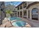 Expansive screened-in patio with a pool and a hot tub at 1956 Brantley Cir, Clermont, FL 34711