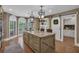Kitchen island with granite countertops and large windows at 1956 Brantley Cir, Clermont, FL 34711