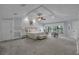Spacious main bedroom with tray ceiling, sitting area, neutral color palette, and ample natural light at 1956 Brantley Cir, Clermont, FL 34711