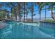 Relaxing screened-in pool and waterfront views at 1956 Brantley Cir, Clermont, FL 34711