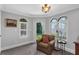 Cozy sitting room with views to the outside and a water view through the window at 1956 Brantley Cir, Clermont, FL 34711
