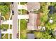 Bird's eye view showing the home, long driveway, mature trees, and adjacent street at 2007 Mosher Dr, Orlando, FL 32810