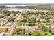 Expansive aerial view of the neighborhood with lush trees, well-maintained lawns, and a glimpse of the cityscape at 2007 Mosher Dr, Orlando, FL 32810
