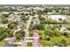 Aerial neighborhood view, showcasing manicured lawns and mature tree coverage at 2007 Mosher Dr, Orlando, FL 32810