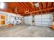 Spacious garage featuring multiple doors, an orange ceiling, and ample space at 2007 Mosher Dr, Orlando, FL 32810