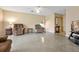 Bright living room with a ceiling fan, polished floors, and cozy armchairs creating a relaxed atmosphere at 2007 Mosher Dr, Orlando, FL 32810