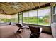 Comfortable screened porch with ceiling fans, perfect for enjoying the outdoor view at 2007 Mosher Dr, Orlando, FL 32810