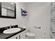 Bathroom with sleek vanity, modern fixtures, and classic blue accents for a clean, updated look at 2022 Edgewood Rd, Leesburg, FL 34748
