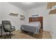 Simple bedroom with carpet, unique headboard, and natural light offers a quiet retreat at 2022 Edgewood Rd, Leesburg, FL 34748