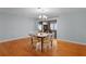 Dining area features hardwood floors and provides access to the home's adjacent rooms at 2022 Edgewood Rd, Leesburg, FL 34748