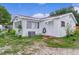 This home features a well-maintained lawn and a clean, white exterior at 2022 Edgewood Rd, Leesburg, FL 34748
