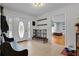 Inviting foyer with tile flooring, bench seating, and a view into the living area at 2022 Edgewood Rd, Leesburg, FL 34748
