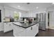 This kitchen features an island and stainless-steel appliances at 2022 Edgewood Rd, Leesburg, FL 34748
