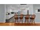 Bright kitchen with sleek countertops, modern appliances, and a stylish breakfast bar at 2022 Edgewood Rd, Leesburg, FL 34748