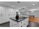 This kitchen features an island and modern lighting fixtures at 2022 Edgewood Rd, Leesburg, FL 34748