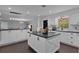This kitchen features an island and modern lighting fixtures at 2022 Edgewood Rd, Leesburg, FL 34748